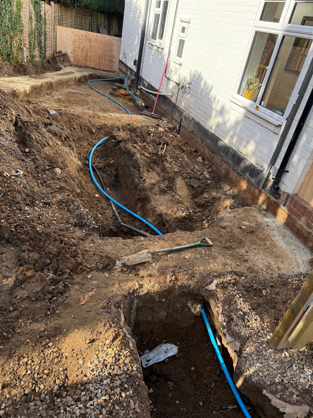 Meridian Plumbing team at work — moling and pipe replacement in London