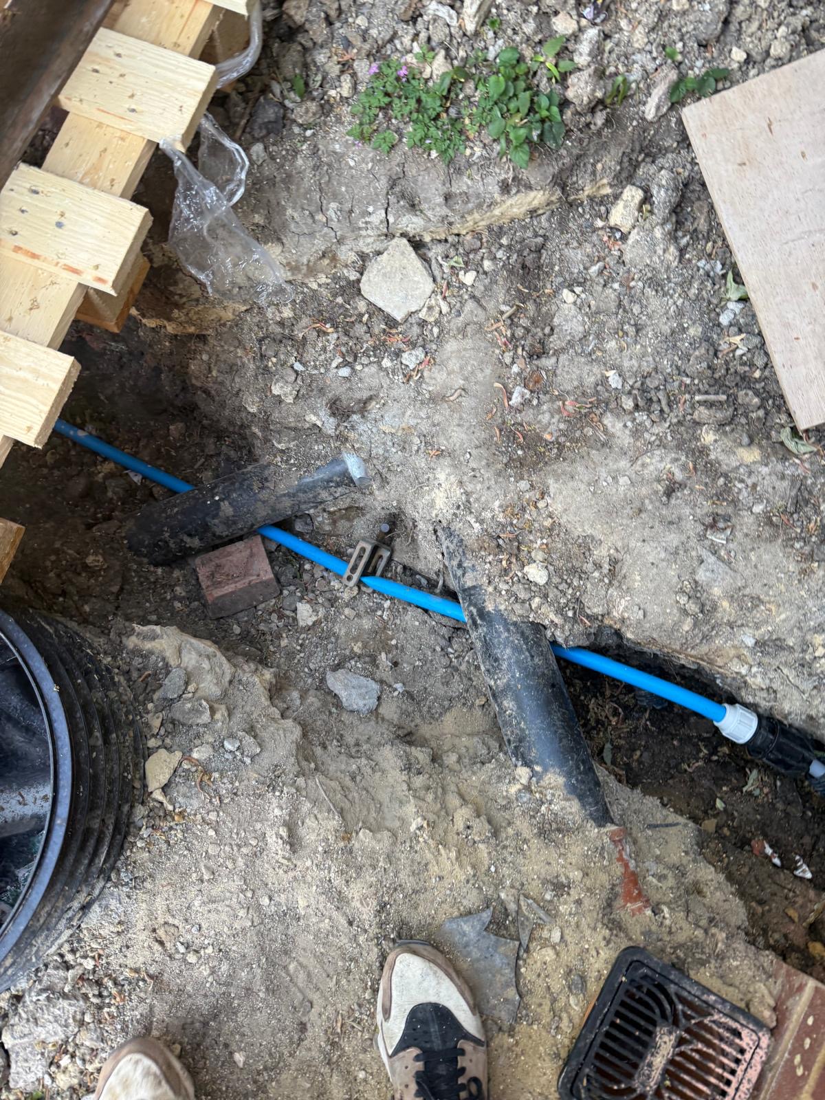 Moling project 3 — deep excavation with MDPE blue service pipe visible