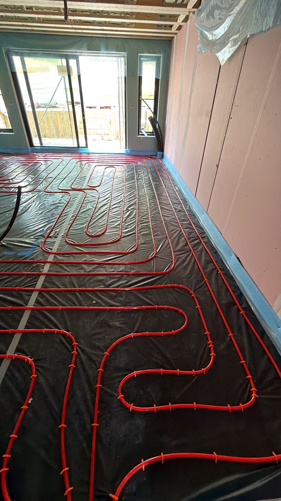 Dense, evenly spaced underfloor heating pipe loops