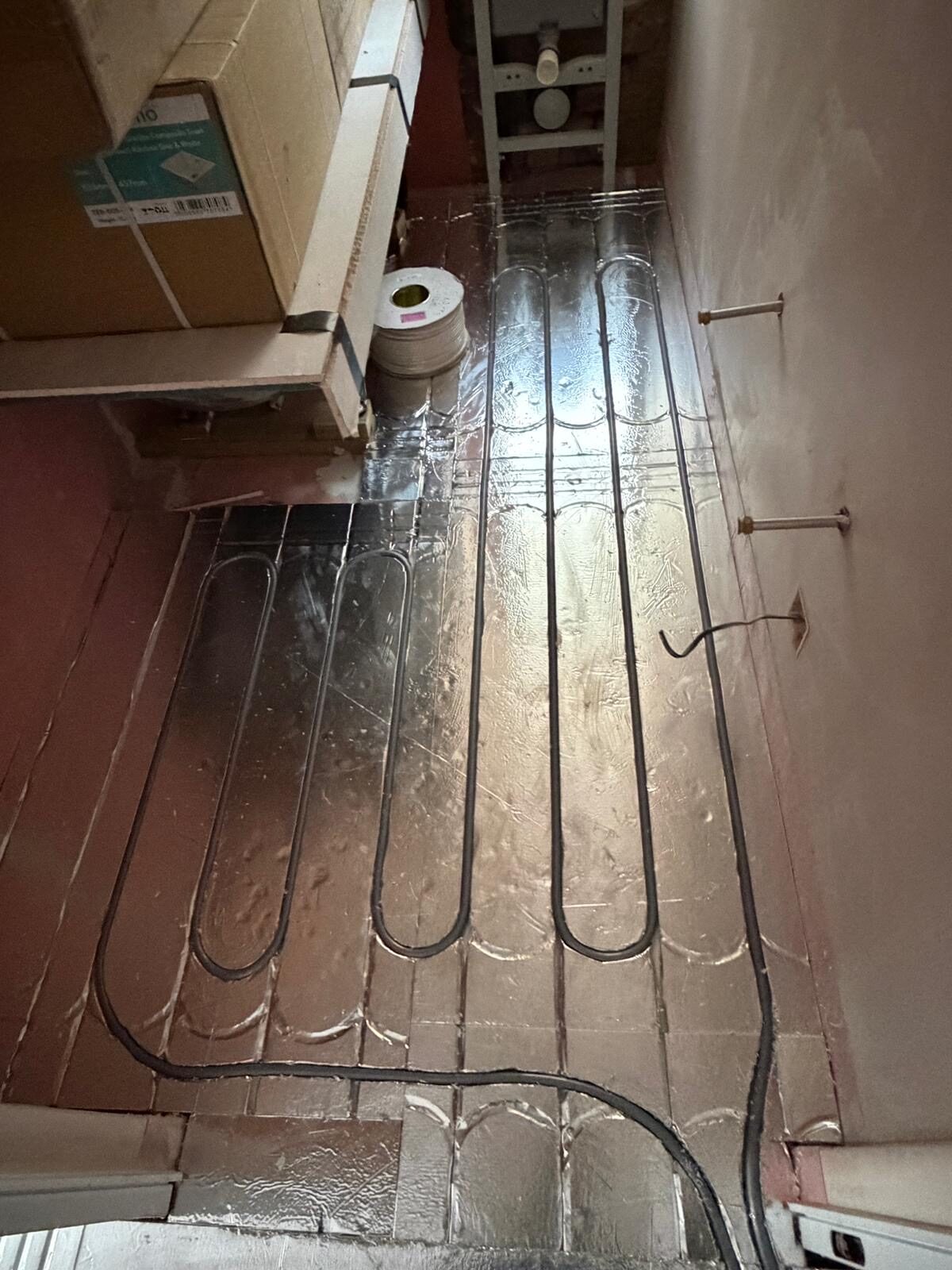 Finished floor over a completed wet underfloor heating system by Meridian Plumbing