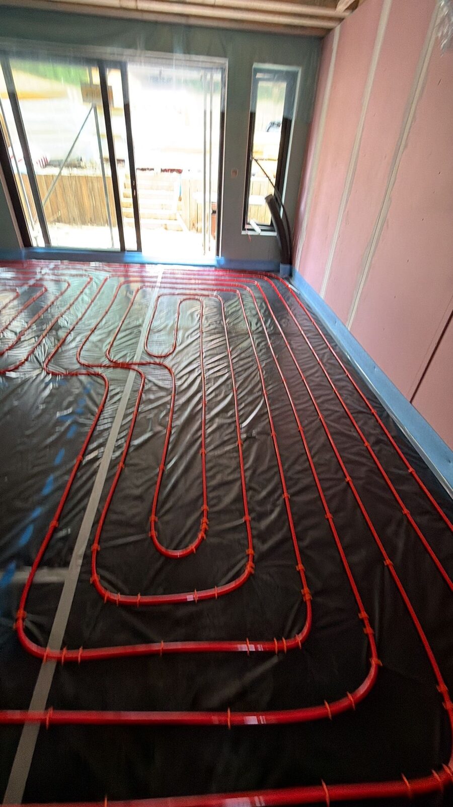 Foil-faced underfloor heating board system in a London room