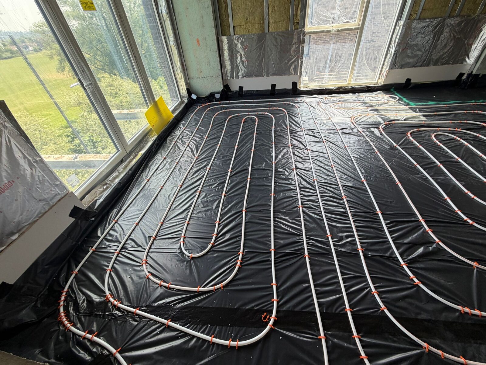 Bright London room fitted with whole-room wet underfloor heating