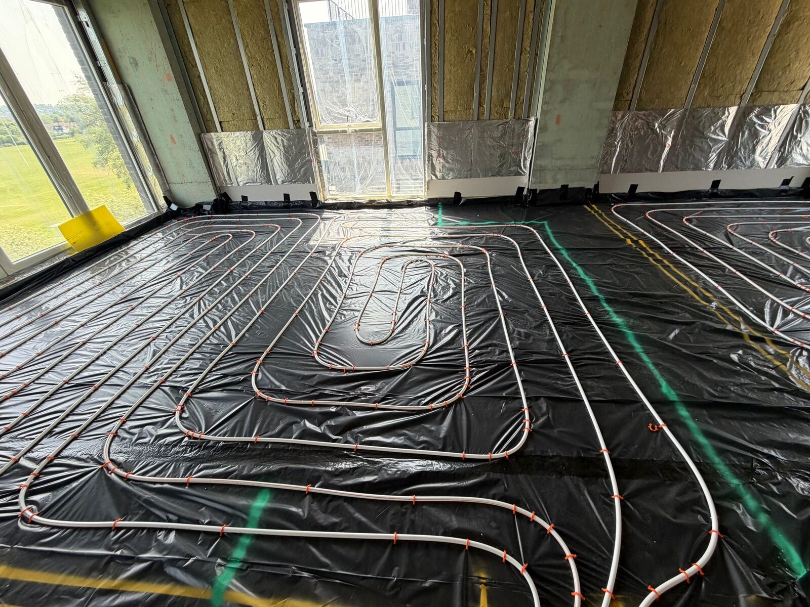 Underfloor heating loops covering a full room